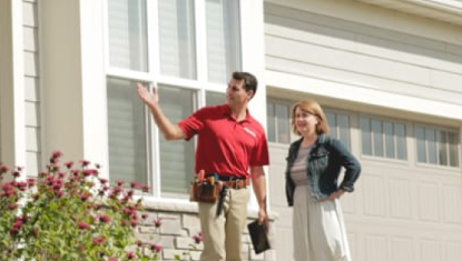 AmeriSpec inspector inspecting a home with the homeowner nearby